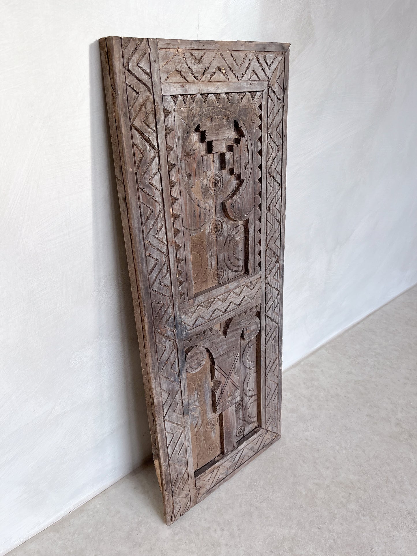 Carved wood wall hanging